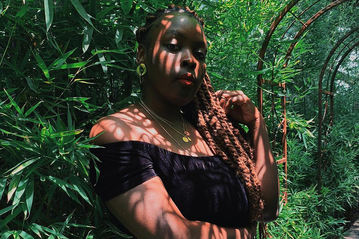 Portrait of an artist among foliage