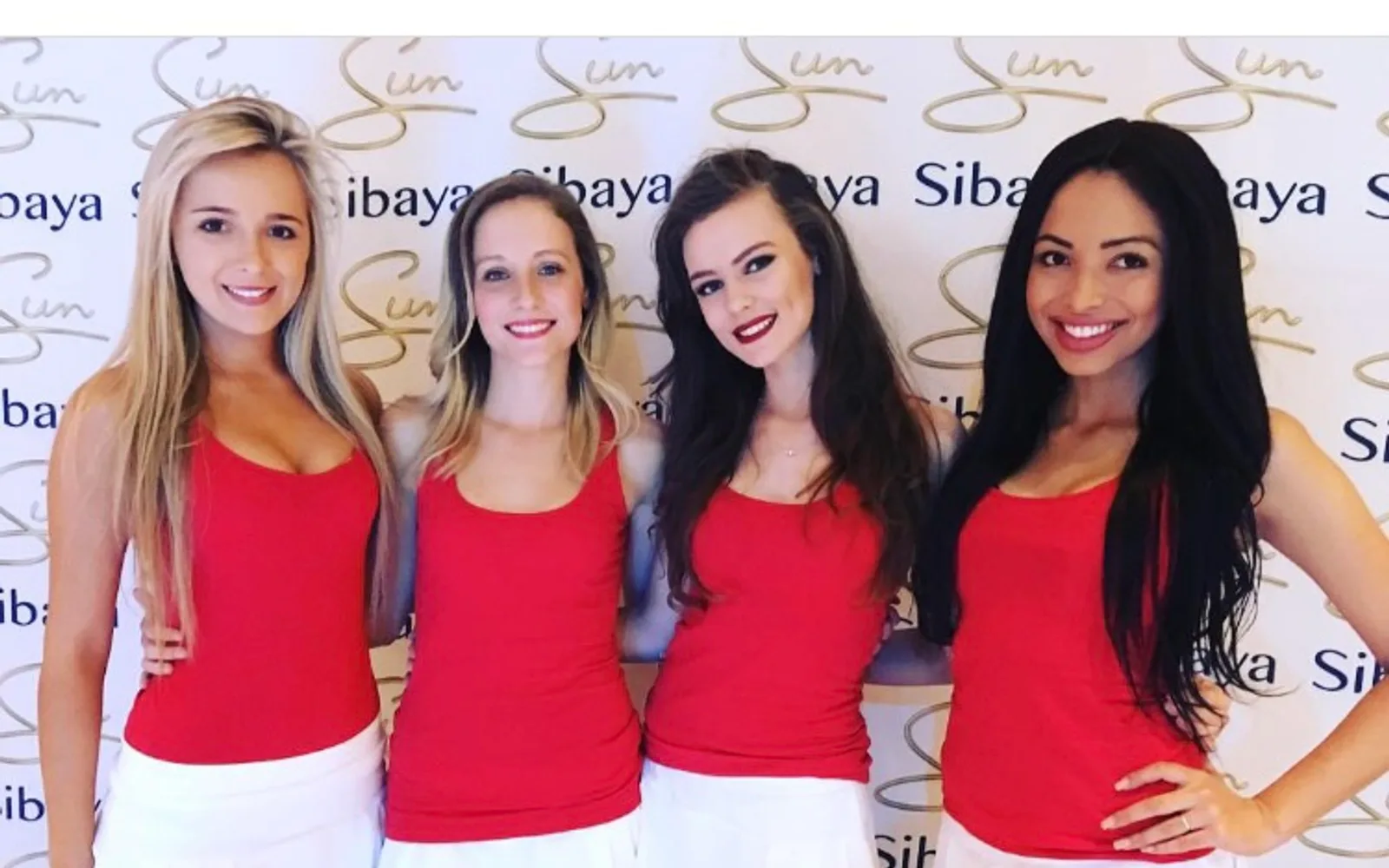 Sibaya Sun hosts on a branded step-and-repeat